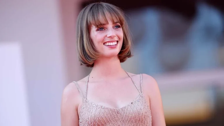 Maya Hawke smiling on set, American actress and singer, known for Stranger Things and music albums Blush & Moss